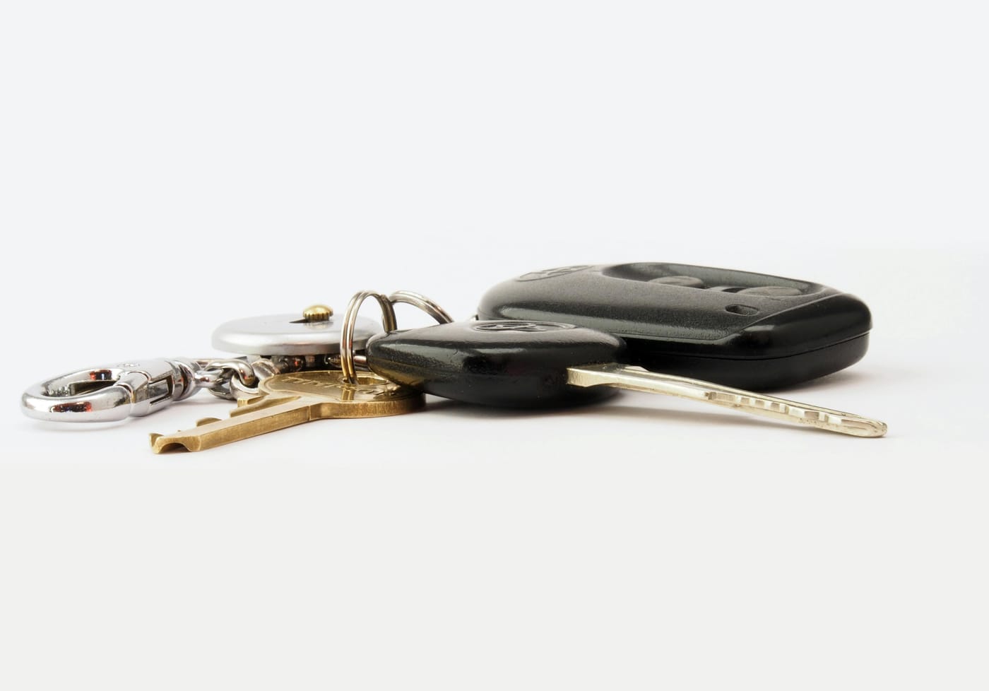 Generic car key fob and transponder key on a white background showing the chip-programmed key used for modern vehicle replacement