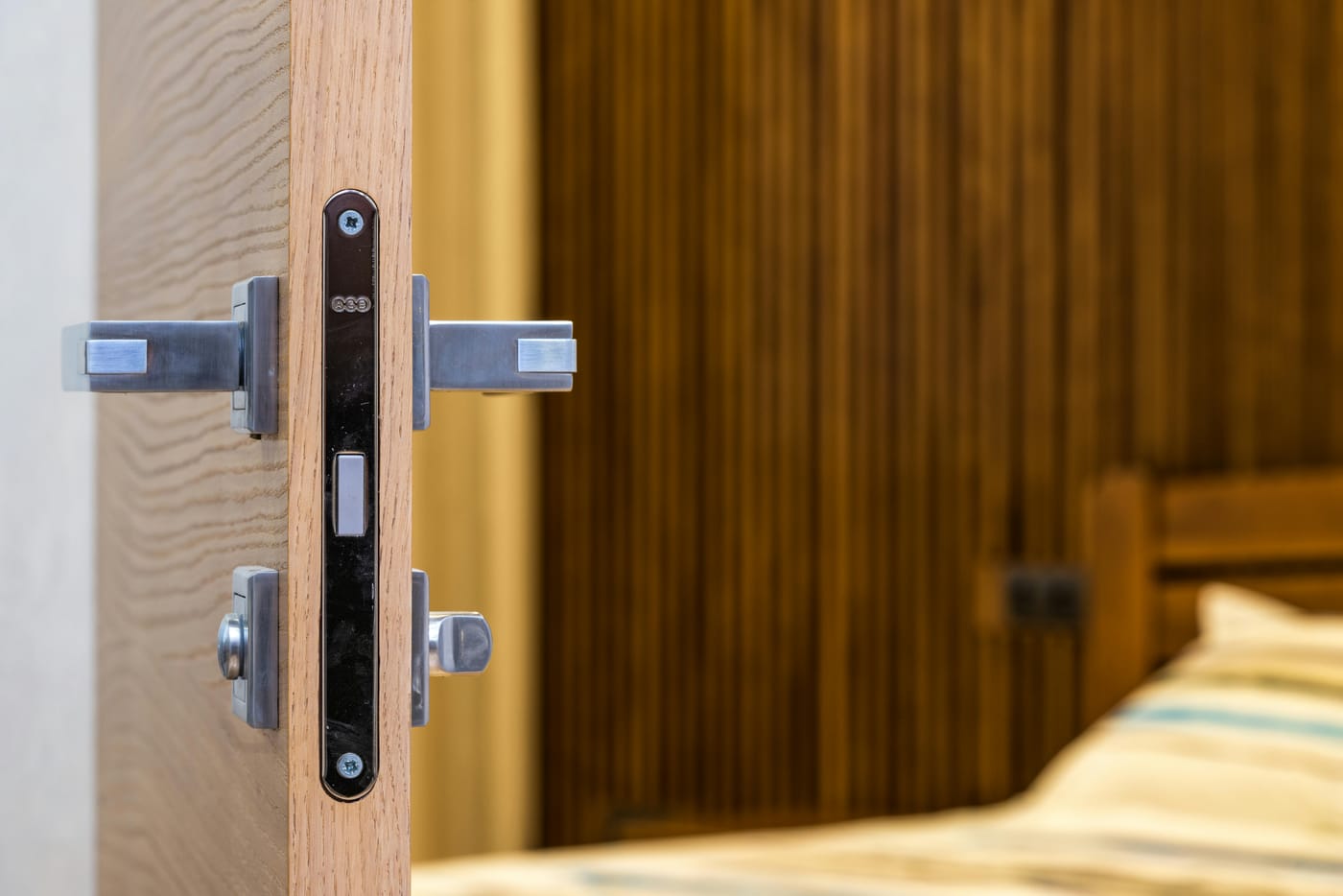 Lever handles and a latch on the edge of an open interior door
