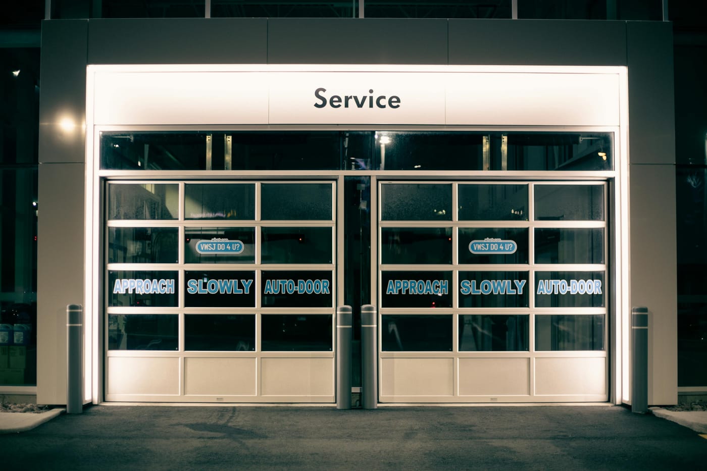 Glass service entrance illuminated at night