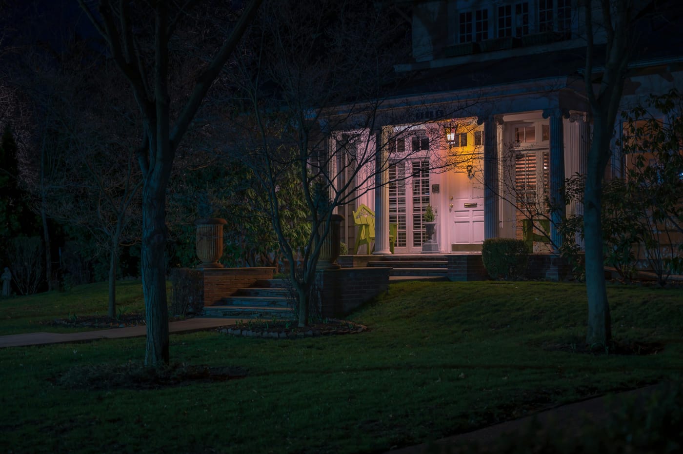 Lit porch on a house at night