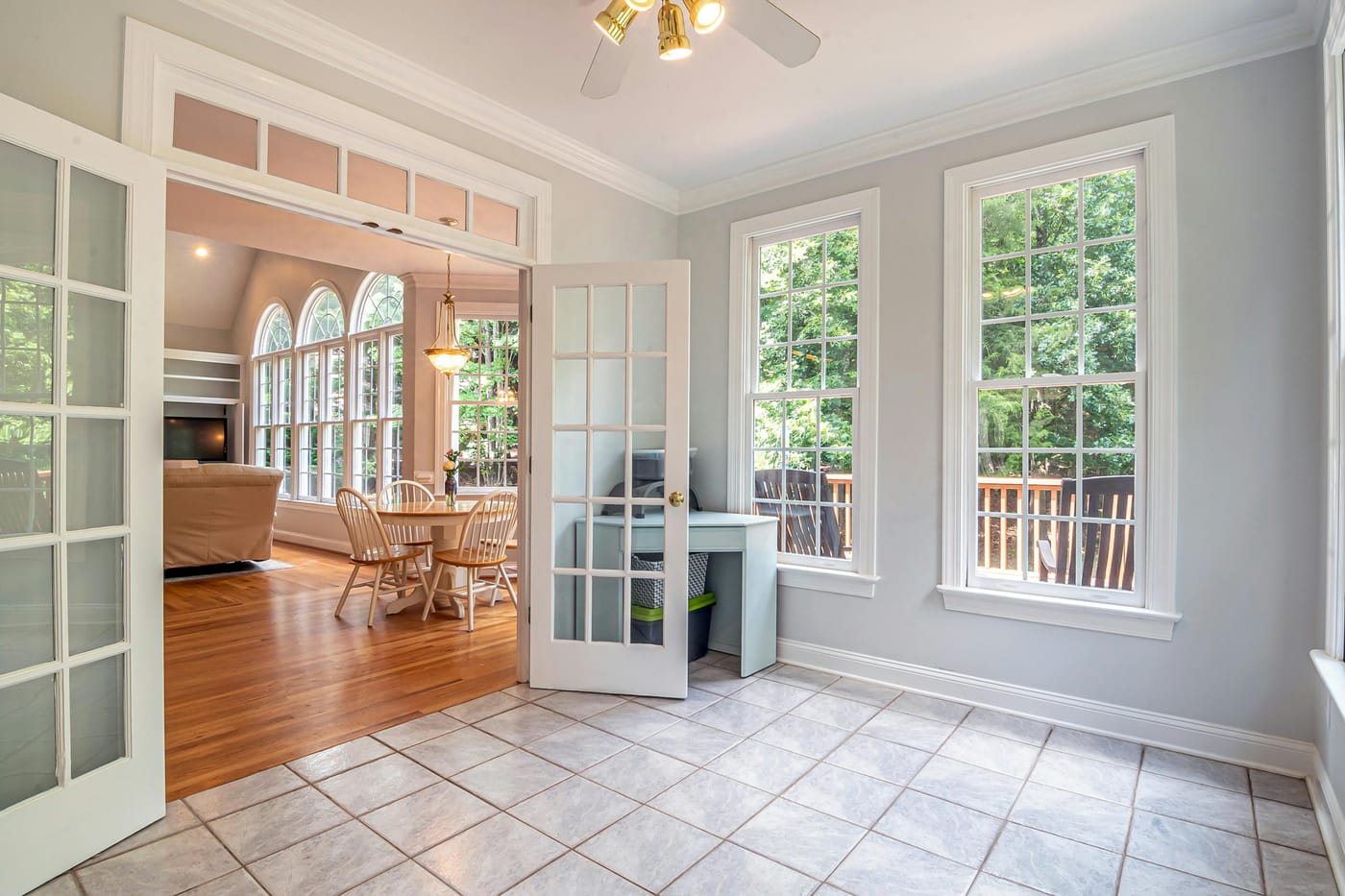 White glazed French doors opening into a bright room