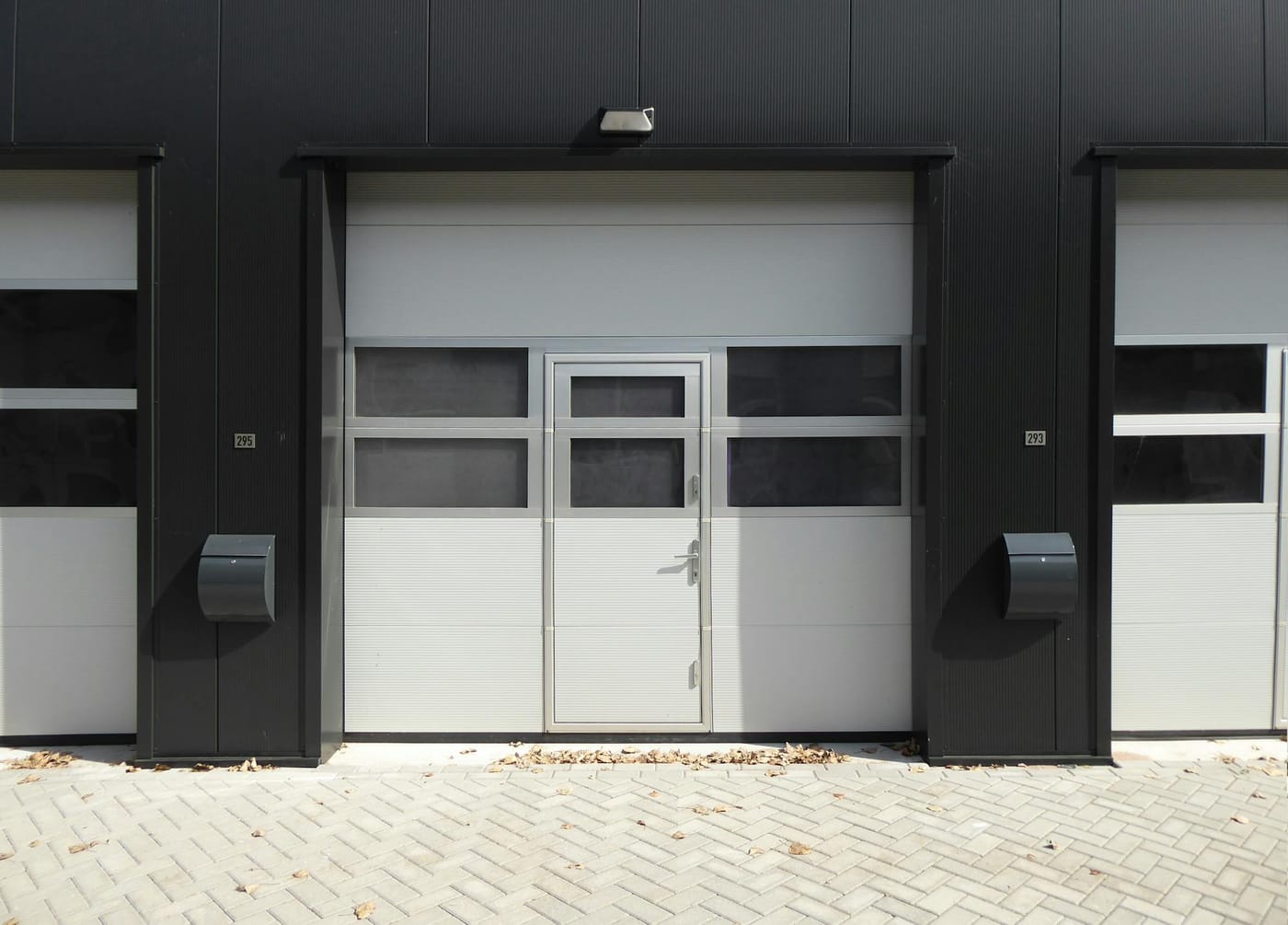 Sectional loading-bay doors with small windows