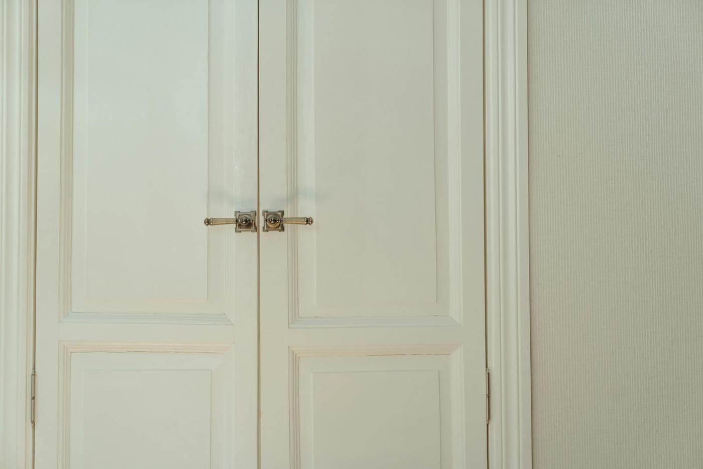 Pair of cream paneled closet doors