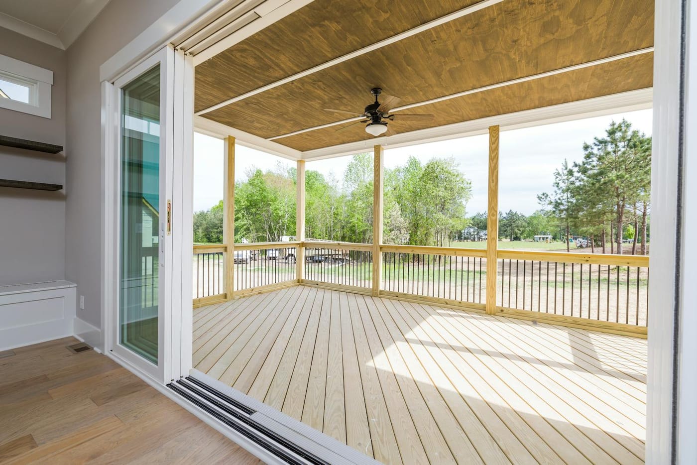 Open patio doorway leading to a covered porch