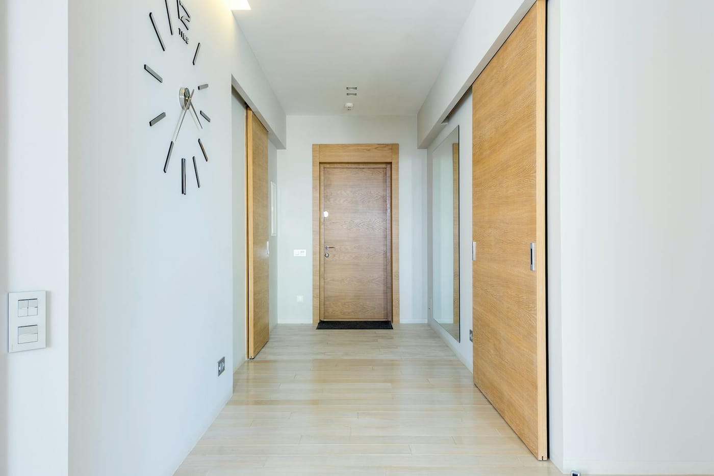 Bright hallway with wooden interior doors