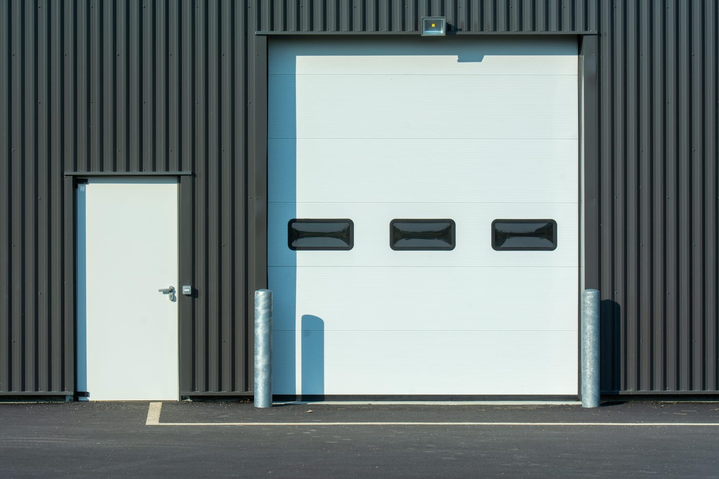 Insulated industrial door with small rectangular windows