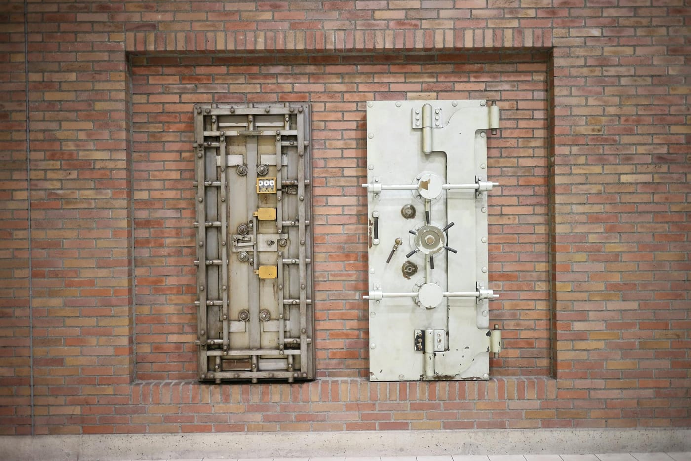 Old steel vault doors set into a brick wall