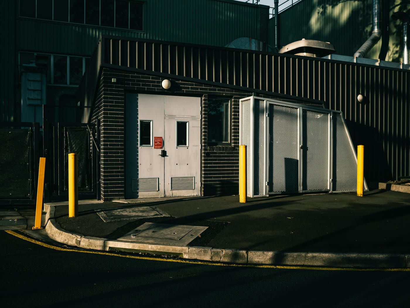 Industrial building entrances with protective bollards