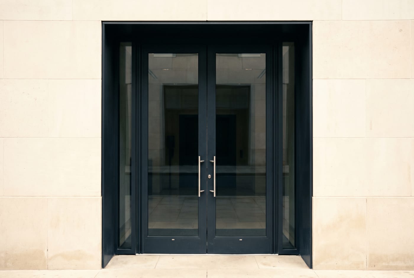 Illustration of black-framed glass double entrance doors