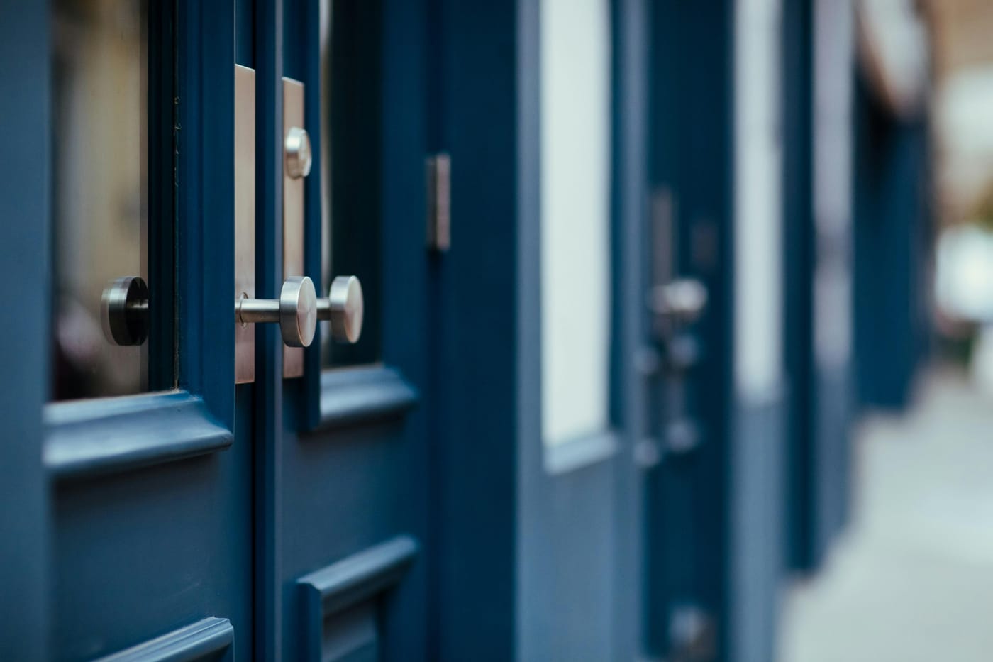 Blue paneled doors with metal knobs