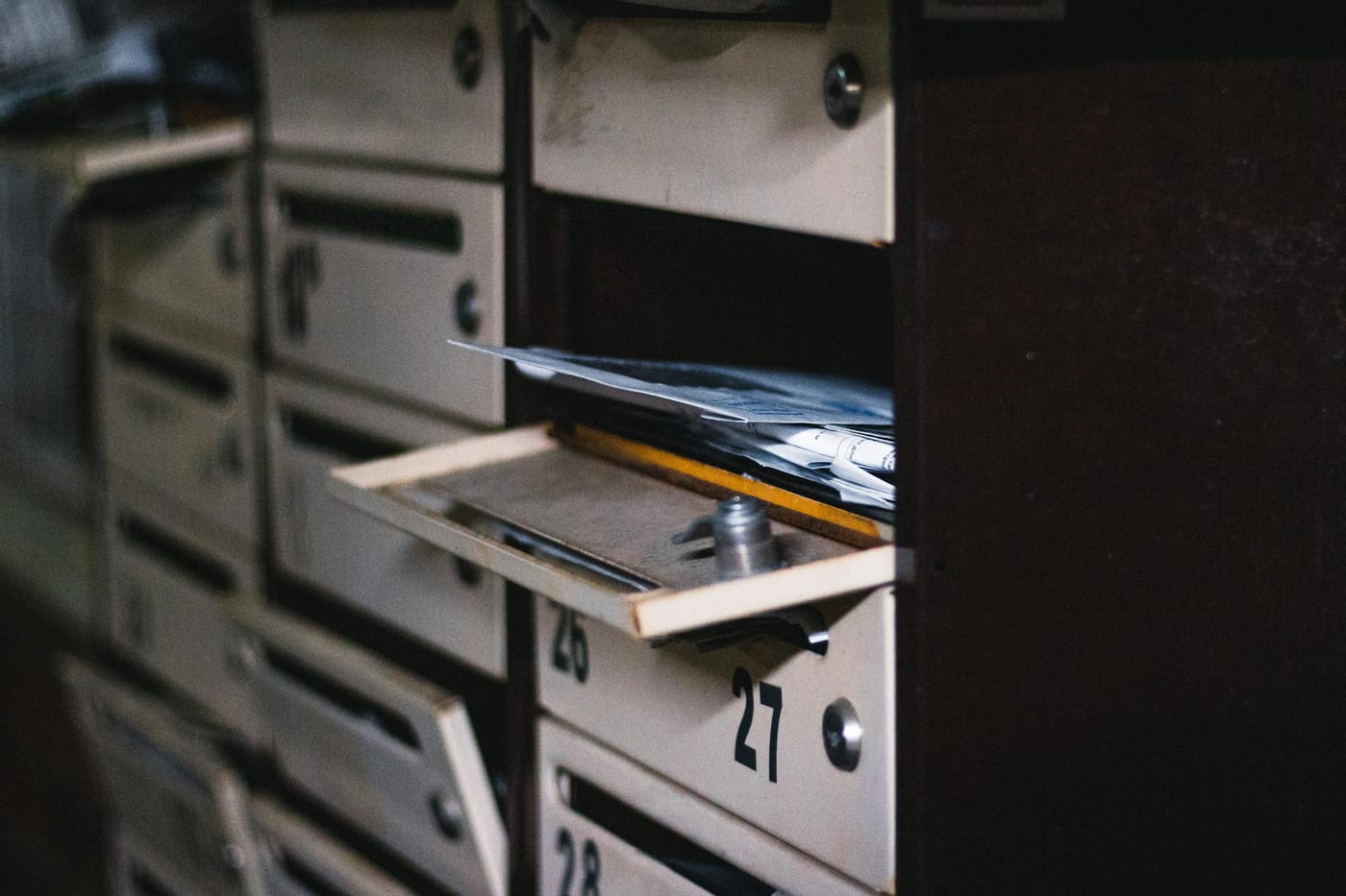 Open apartment mailbox compartment with mail visible inside, residential cluster mailbox lockout service Washington DC