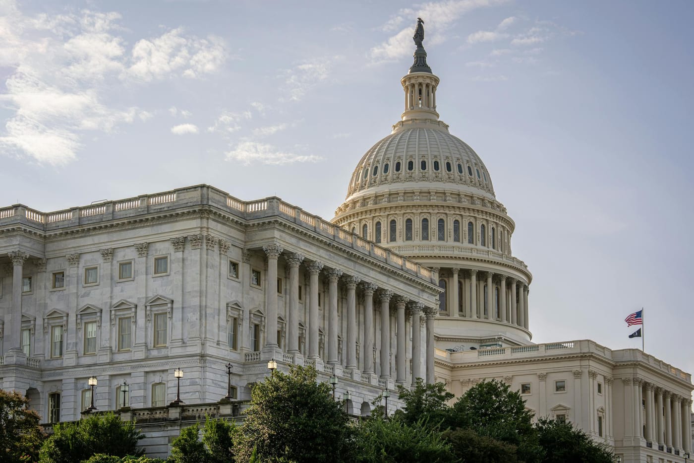 US Capitol Building with American flag at dusk, representing Southeast DC Capitol Hill locksmith coverage area