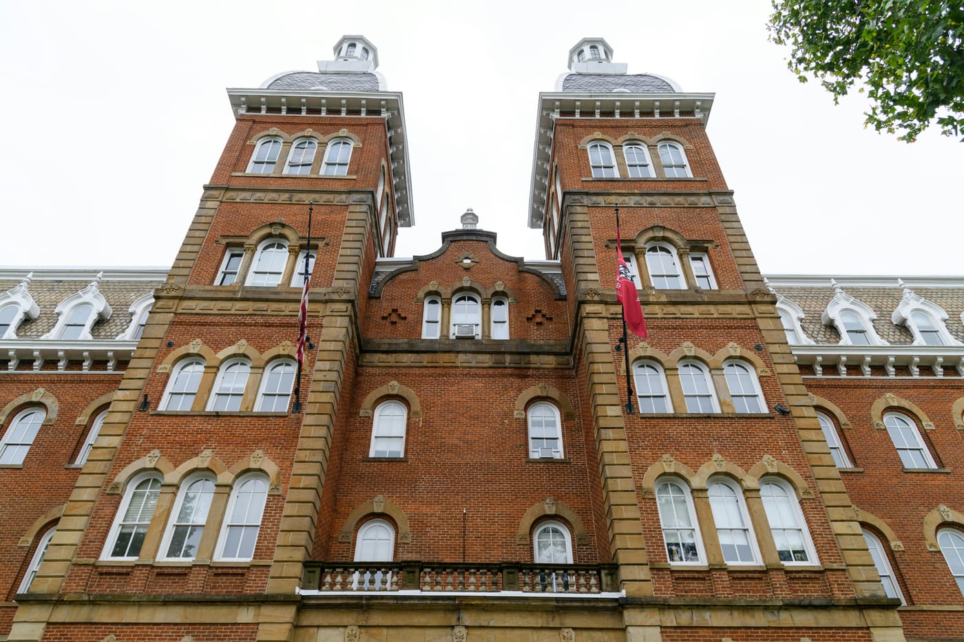 Red brick institutional building with two square towers