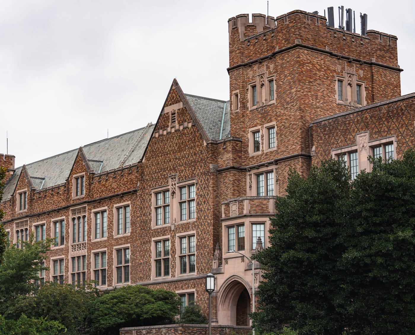 Brick campus building with a crenellated tower