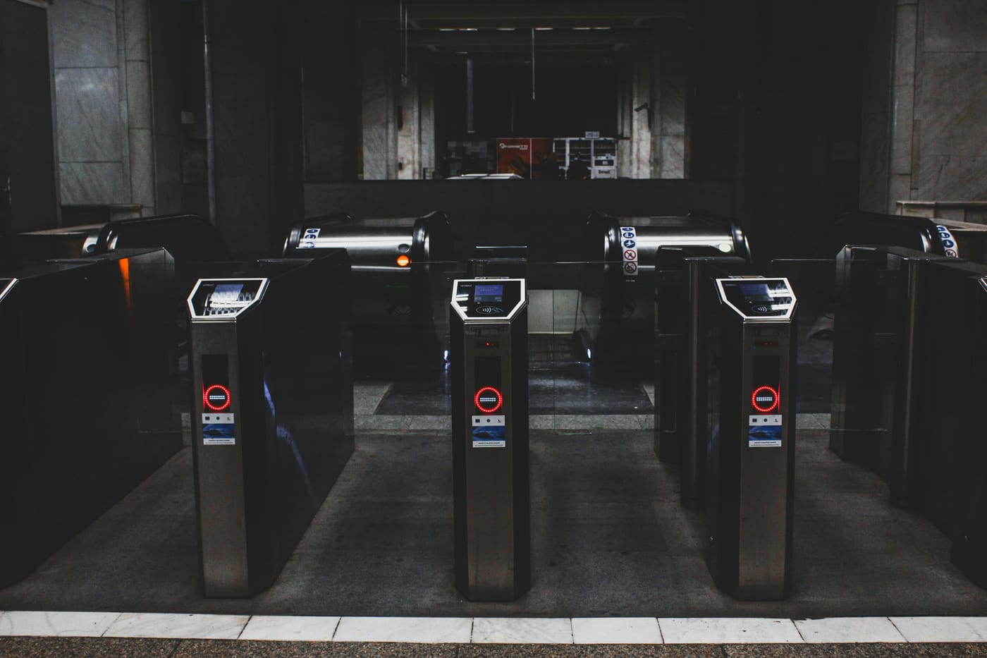 Row of electronic entry gates inside a building