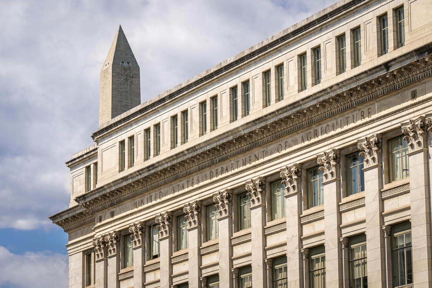 US Department of Agriculture building with the Washington Monument behind it