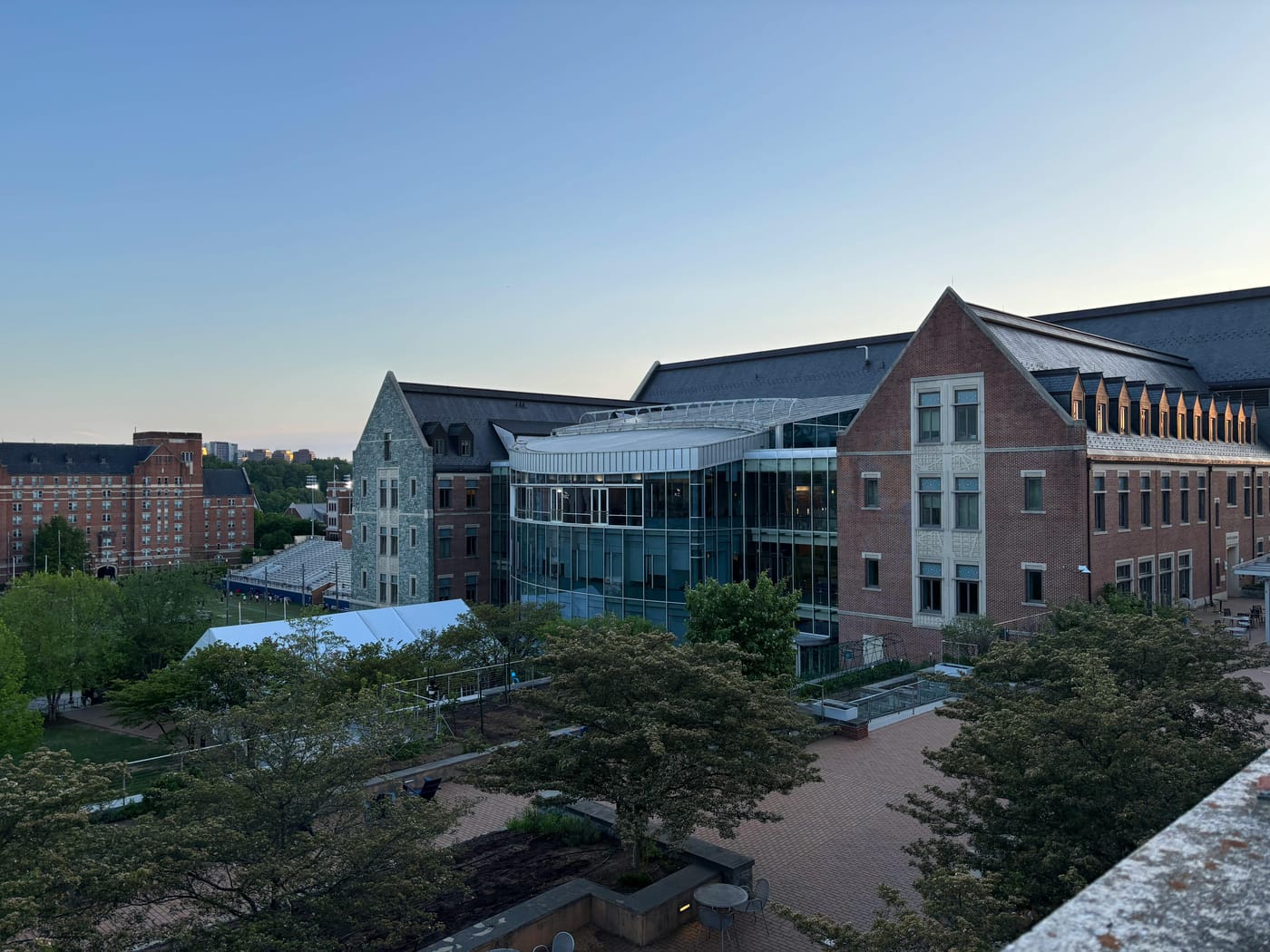 Modern campus building with glass walls and a courtyard