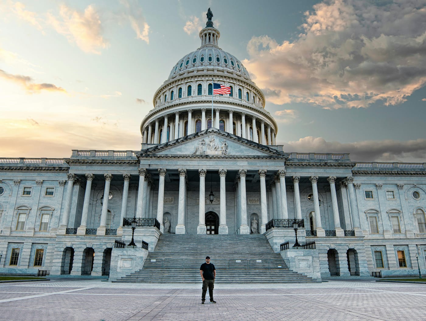United States Capitol beneath a partly cloudy sky