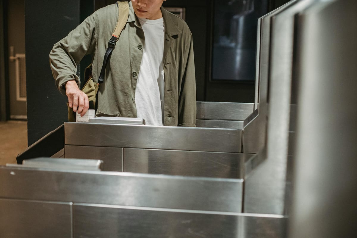 Card access turnstile gate controlling entry to a campus building in Washington DC