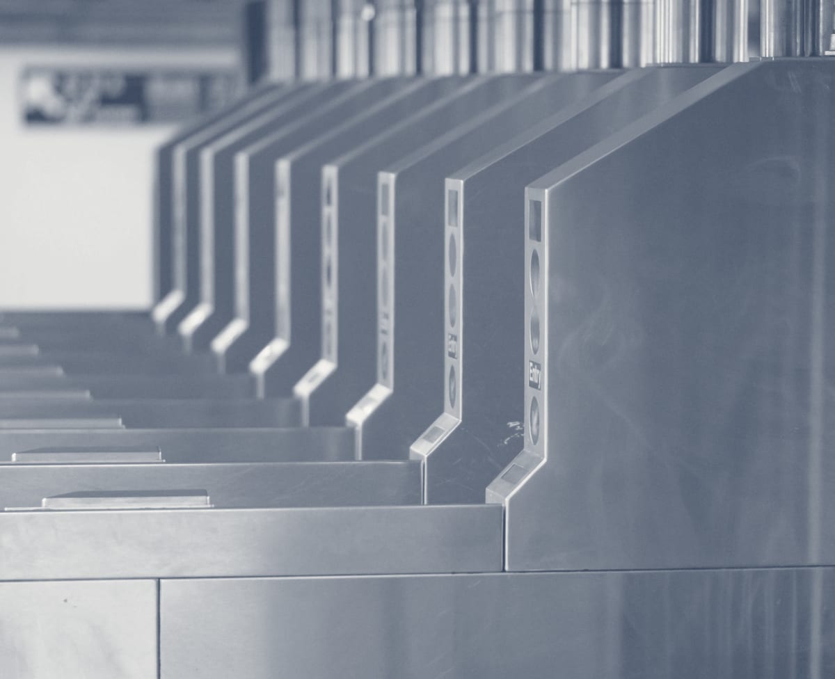 Security turnstile gate for controlled building access in commercial lobby