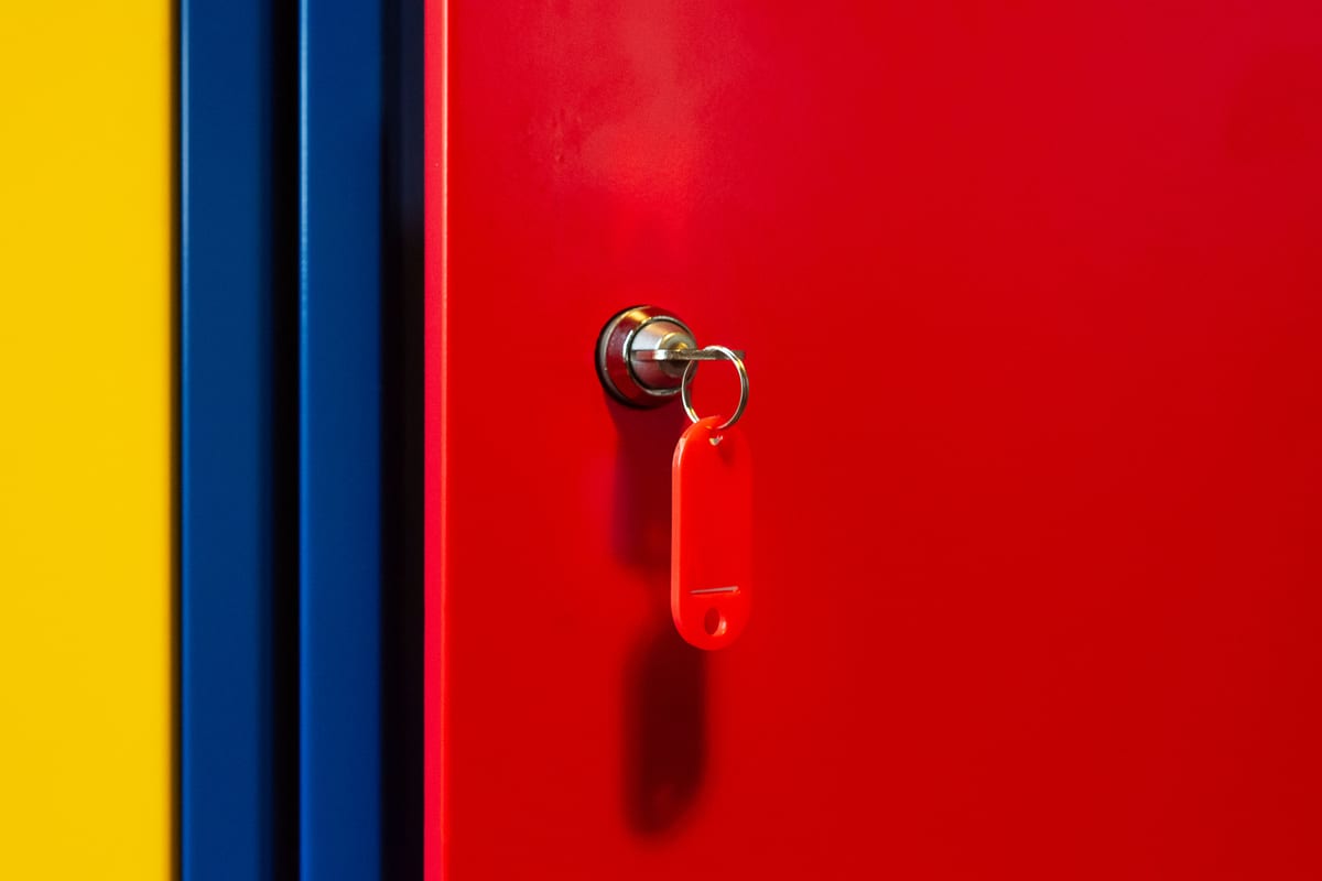 An organized key control cabinet mounted in an institutional facility