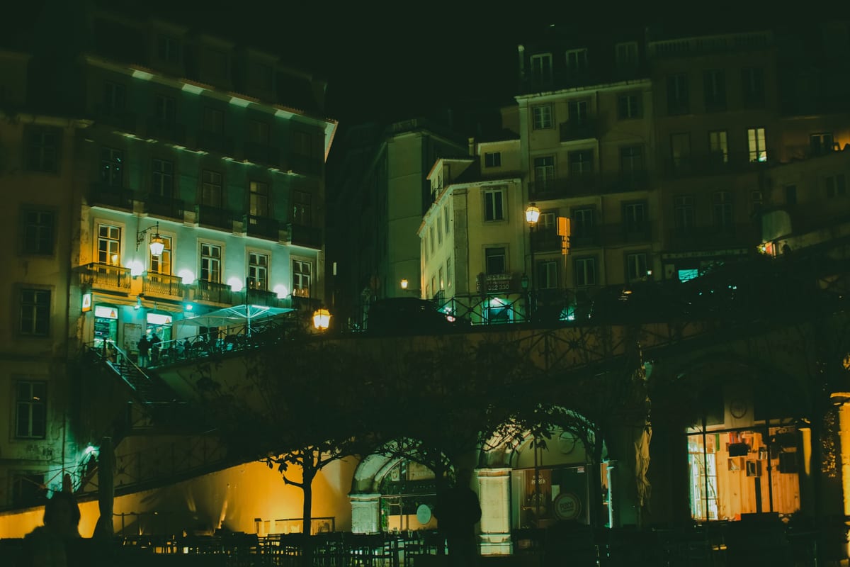 An illuminated city street at night