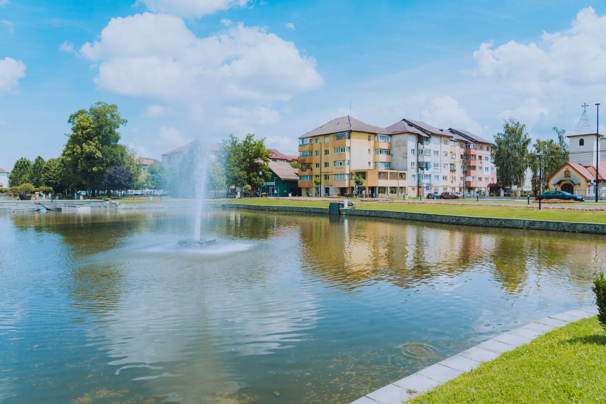 A neighborhood circle park ringed by city buildings