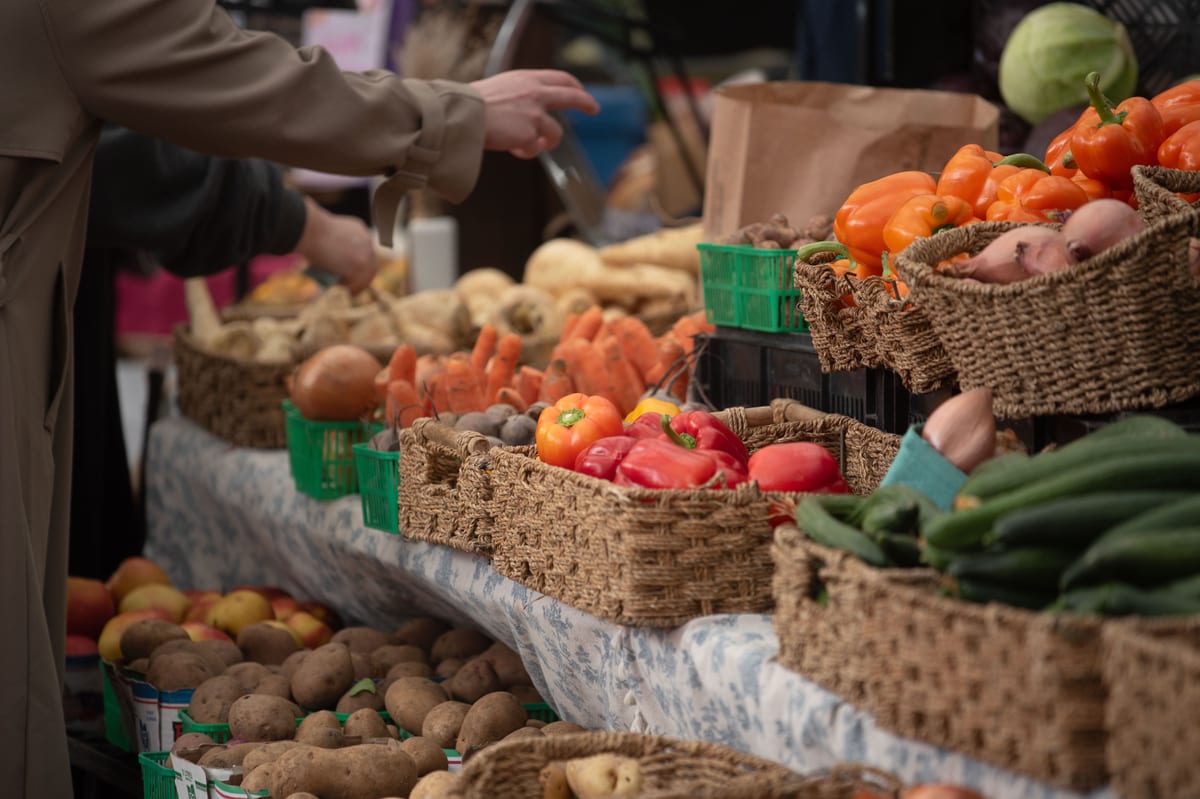 Stalls at a bustling outdoor neighborhood market