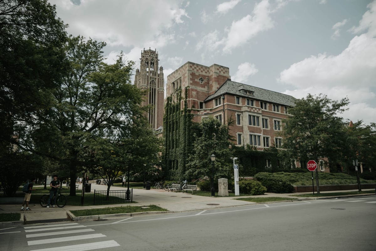 Brick campus buildings in a city neighborhood