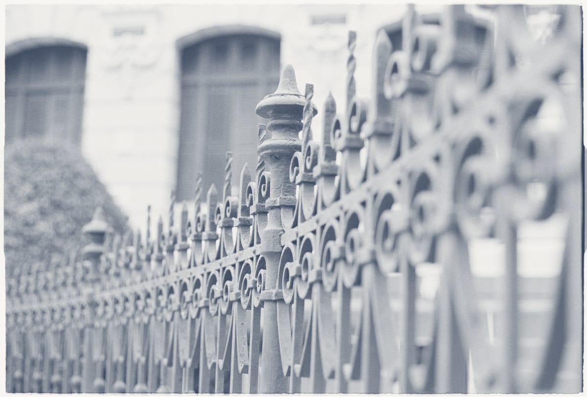 Historic iron fence surrounding a Washington DC university campus perimeter