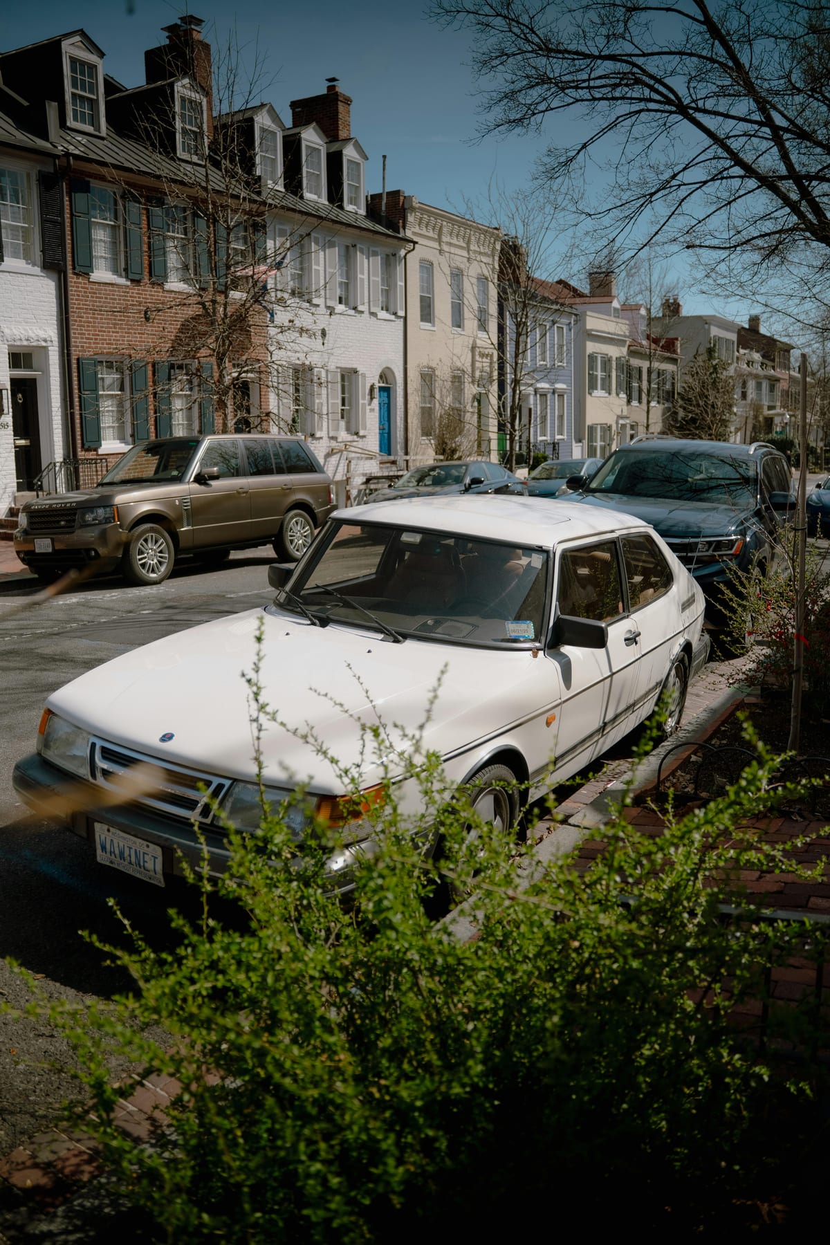 Quiet Georgetown residential street lined with historic colorful rowhouses in Washington DC