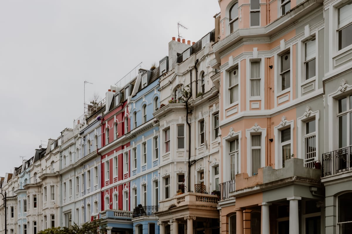 An ornate Victorian rowhouse facade with a bay window