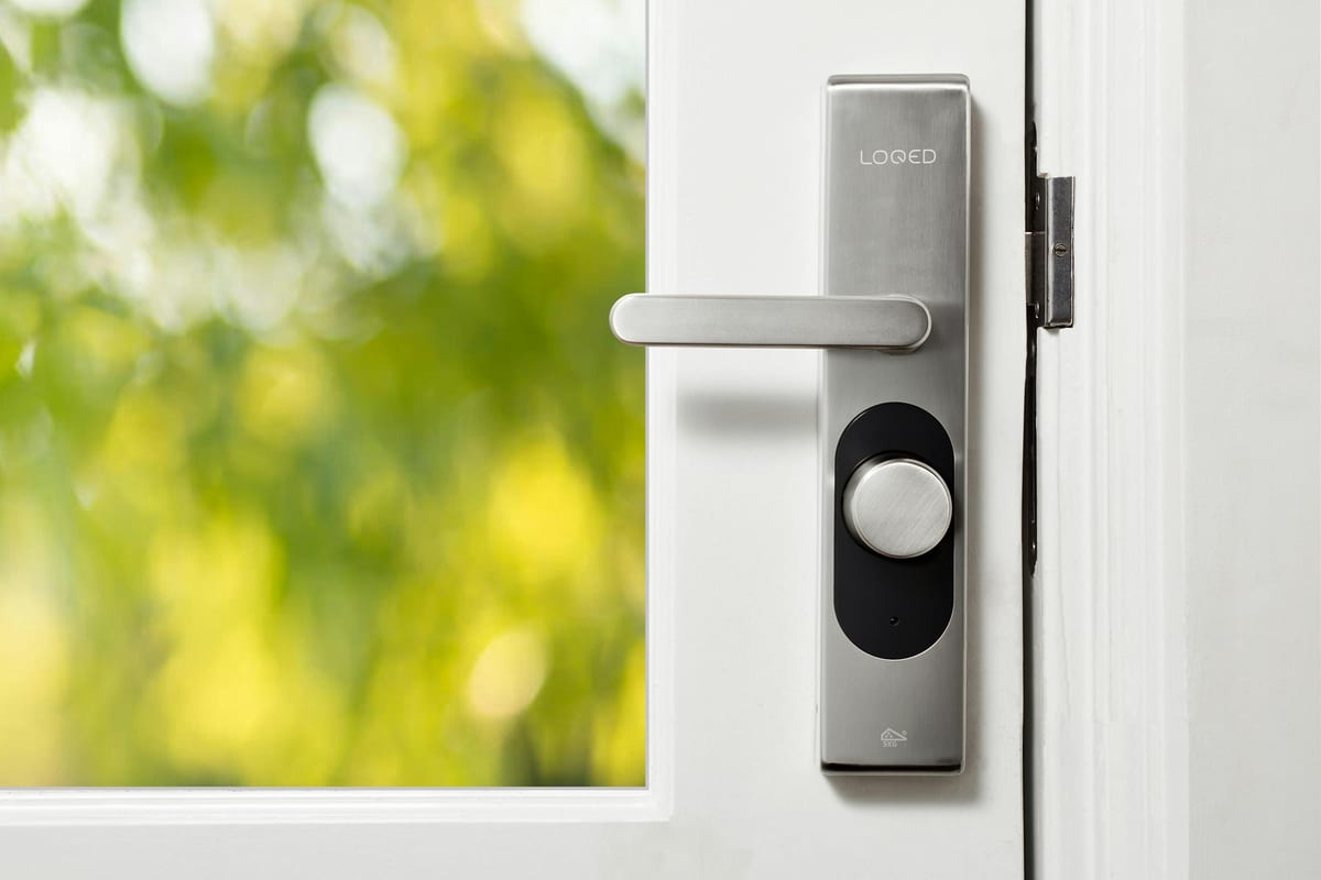 Smart lock with electronic deadbolt installed on a residential door preserving exterior appearance