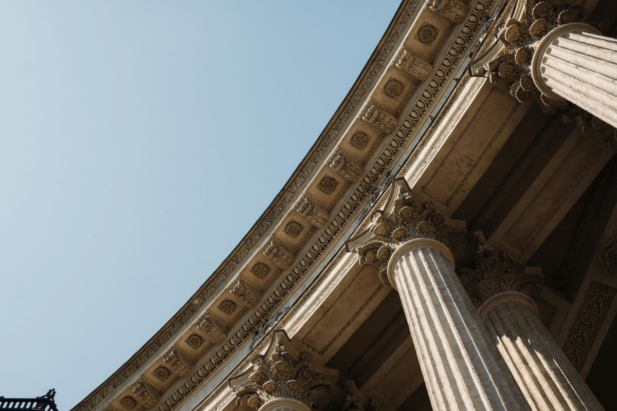 Grand classical columns on a Washington DC federal building exterior along Embassy Row