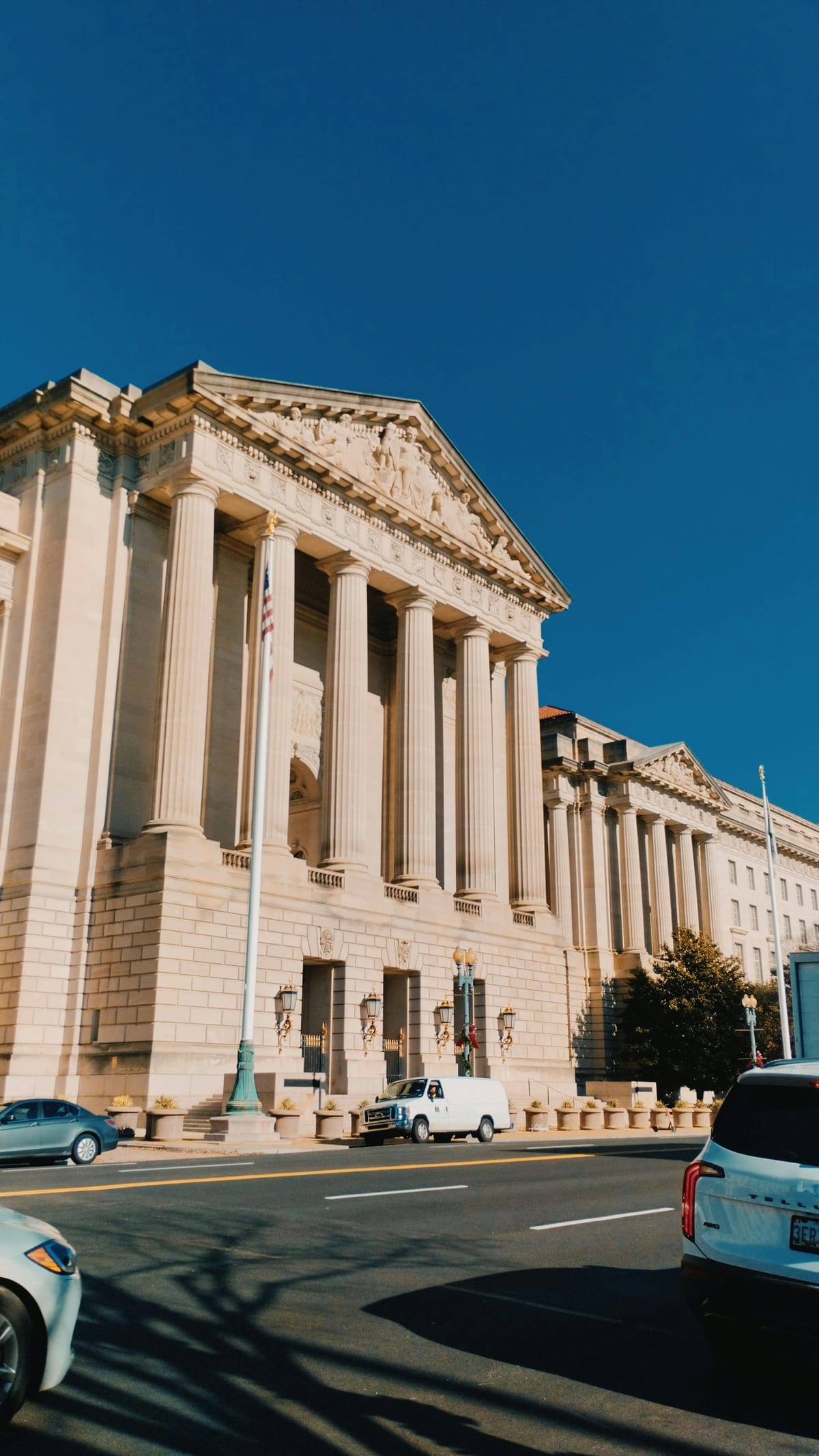 Neoclassical Washington DC building facade under clear sky