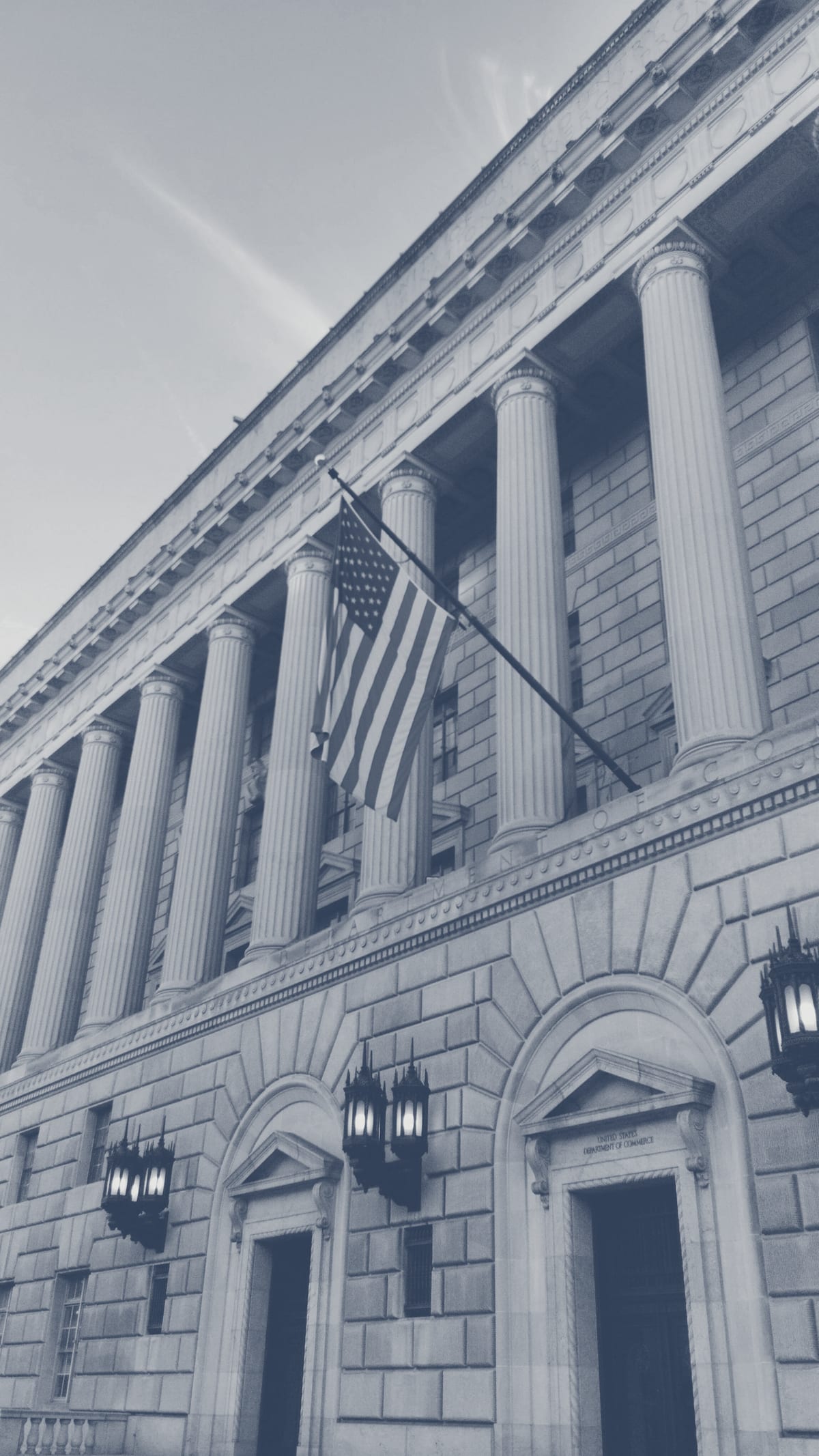 Neoclassical federal building with US flag representing government-grade credentials