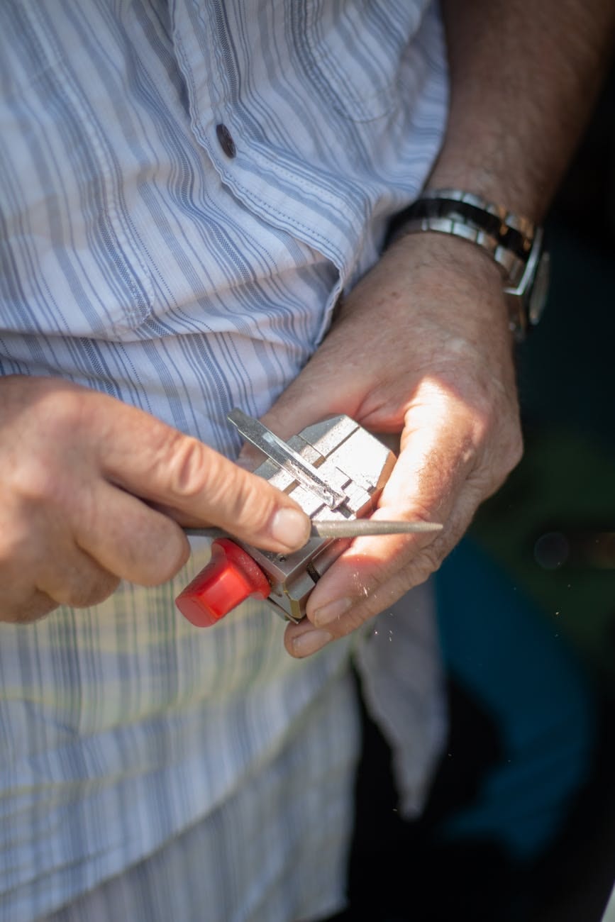 Locksmith using precision tools on a lock cylinder during a professional service call