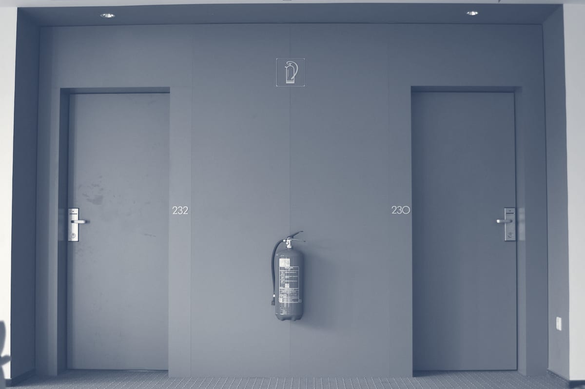 Fire-rated commercial door with ADA-compliant hardware and warning signage