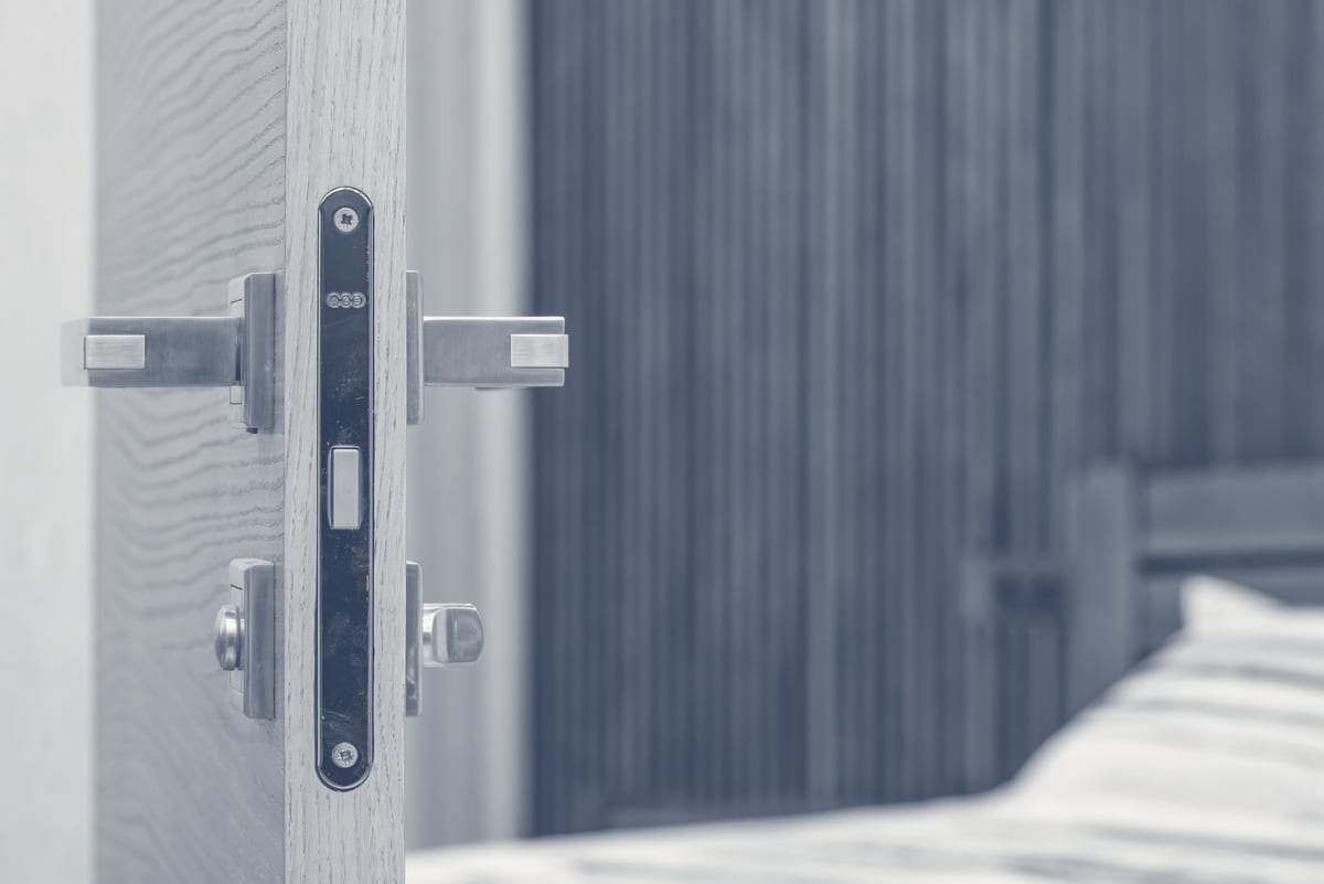 Residential door handle and lock hardware that a scam locksmith might unnecessarily destroy
