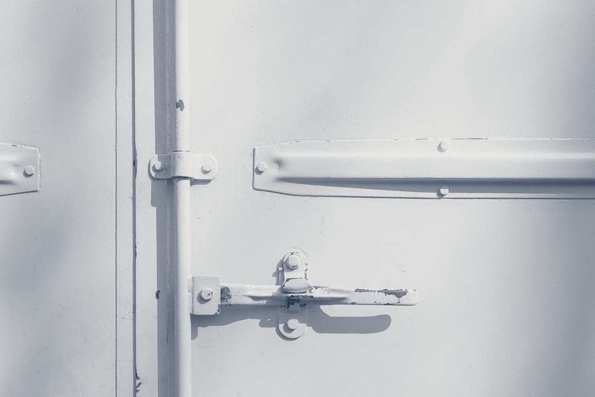 Close-up of a metal door latch bolt in a residential security lock assembly